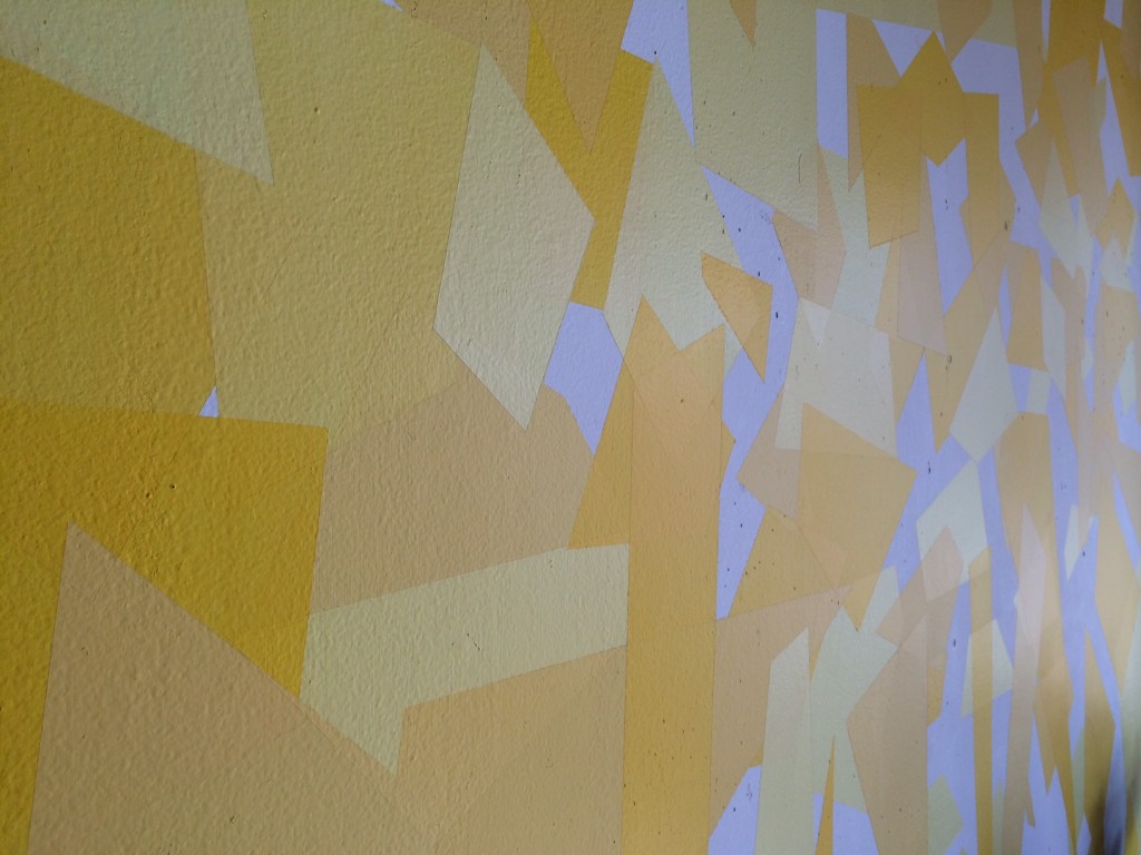 image of yellow fragmented feature wall in the living room